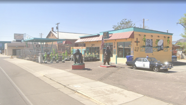 San Miguel Pottery Land storefront in Socorro, New Mexico, featuring pottery displays and alien decorations.